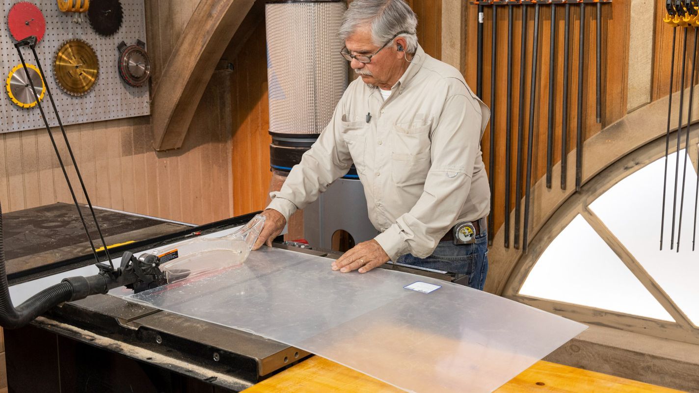 Tom Silva using a table saw to cut plexiglass into smaller strips