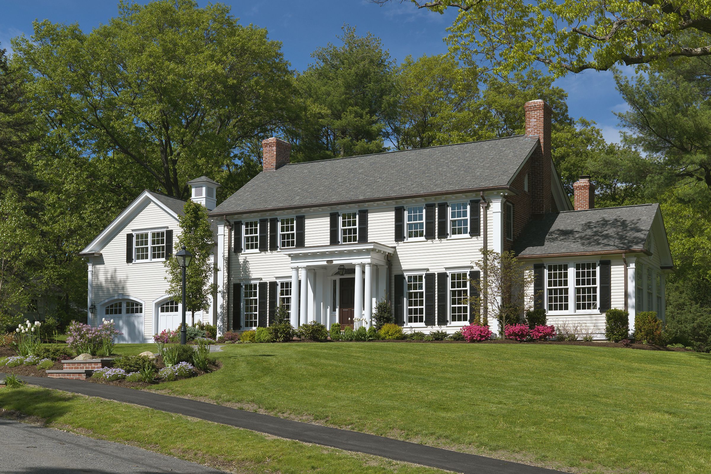 Colonial-revival home with a portico