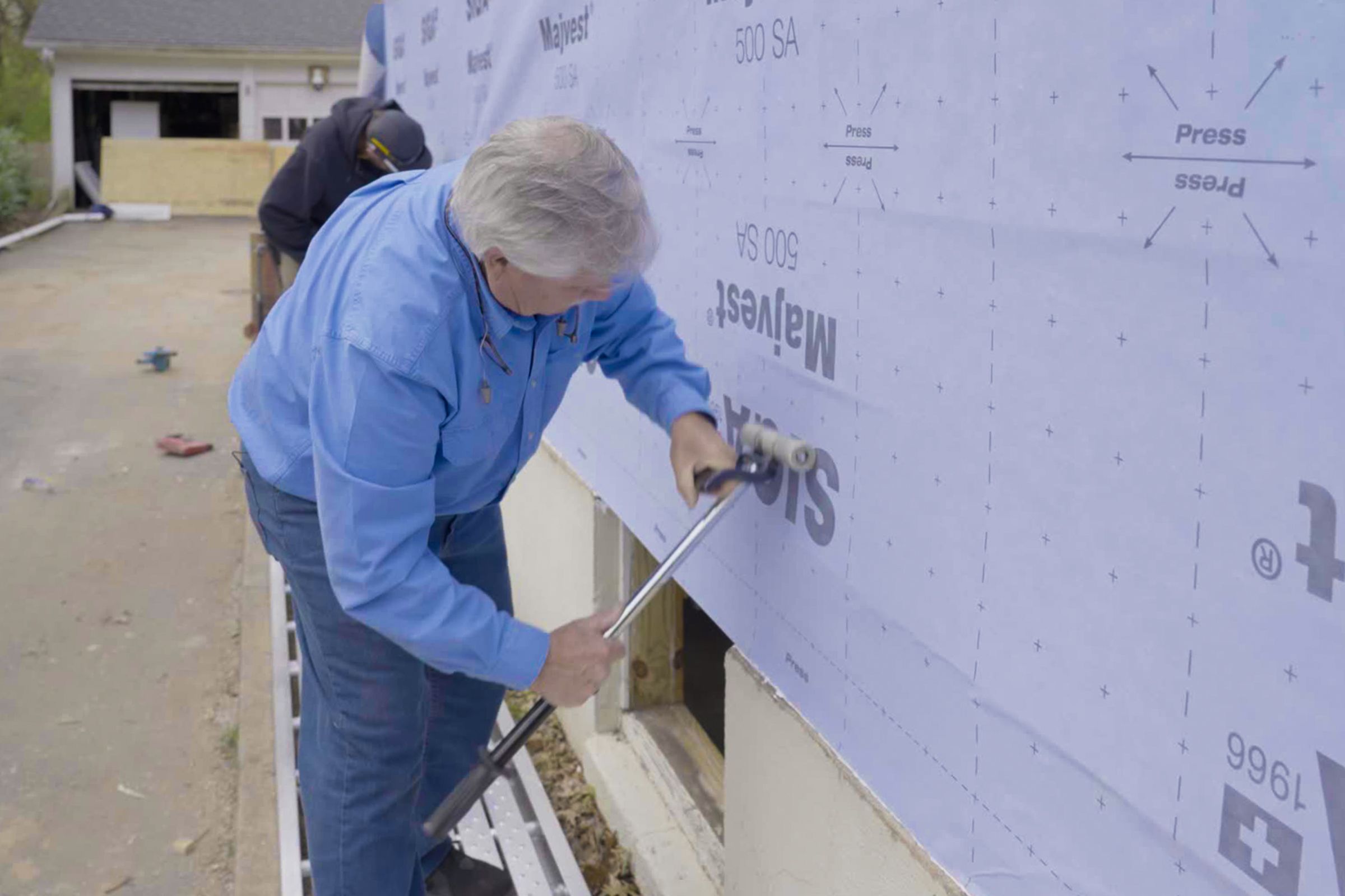 applying a self-adhering membrane as a weather-resistant barrier.