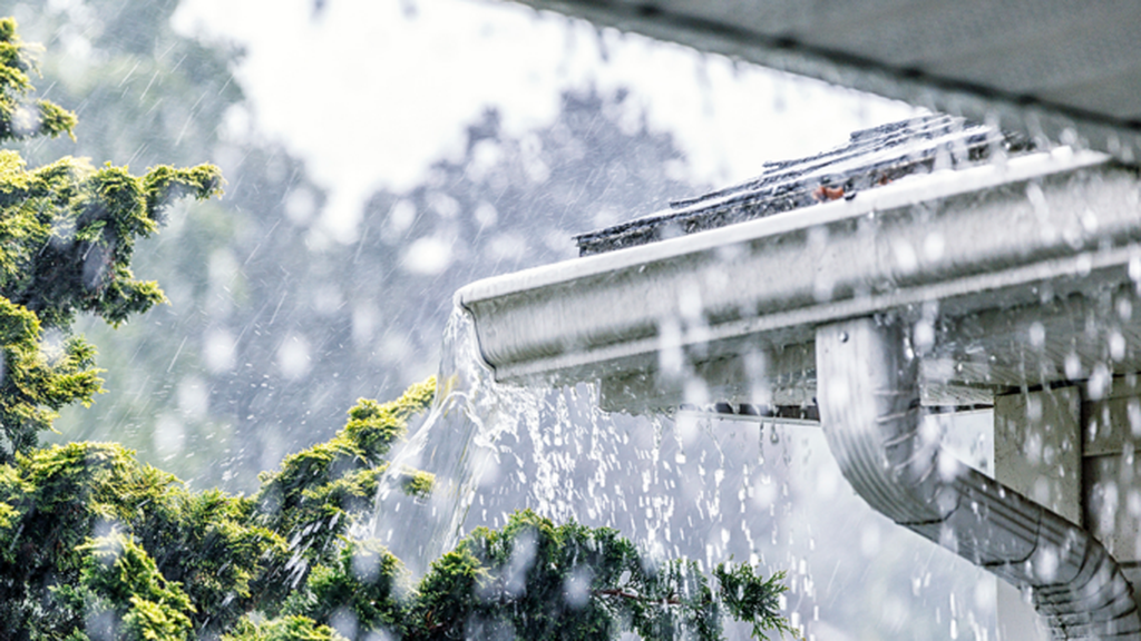 Water flowing out of a gutter system